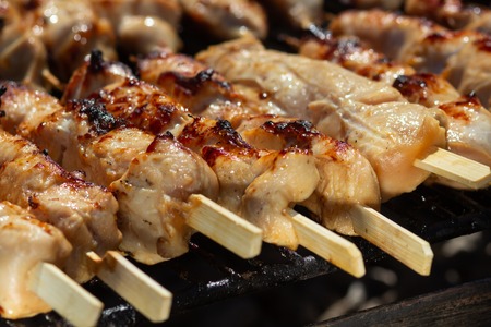 Grilled chicken on bamboo skewers, close up view. Cateringの写真素材