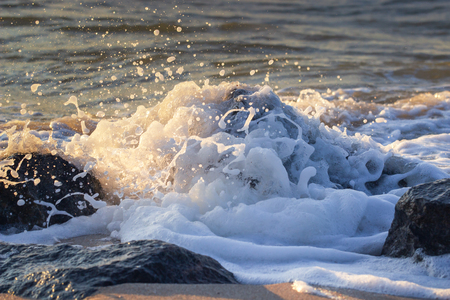 Powerful Waves crushing on a rocky beach.の写真素材