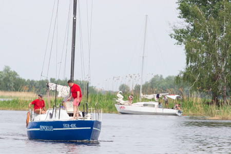 Cherkassy. Ukraine. May 9, 2018. Beautiful racing yacht in the river Dnepr.のeditorial素材