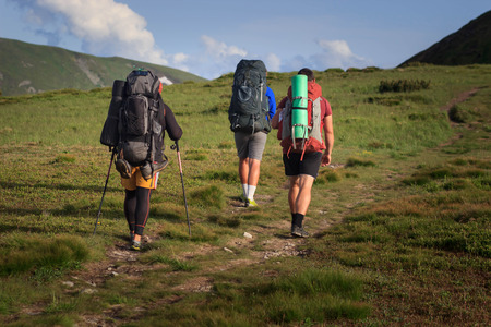 hikers walking in the mountains. goal, success, freedom and achievement concept.の写真素材