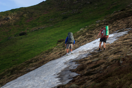 Group of hikers walking in mountainsの写真素材