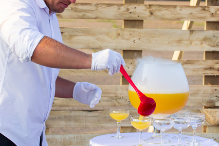 orange juice in big glass on white table.の写真素材
