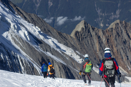 Group of hikers going down a hill