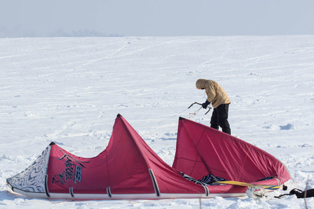 Geroimovka, Ukraine. March 5, 2018 Frosty morning. Man is engaged in winter kiting.のeditorial素材