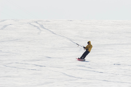 Geroimovka, Ukraine. March 5, 2018 Frosty morning. Man is engaged in winter kiting.のeditorial素材