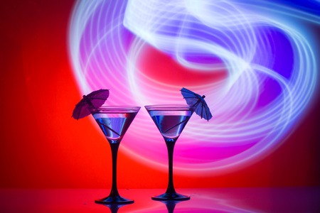 Two glasses of martini coctail in a bar.の写真素材