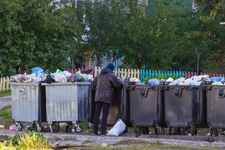 homeless people near the garbage cans,の写真素材