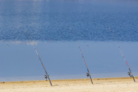 Fishing rod, spoon. fishing bait. close up. throw-line. fishing rod. Rod on the bridge