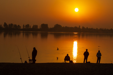 silhouette people are fishing.の写真素材