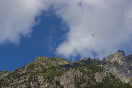 Paragliding over Mont Blanc massif in the French Alps above Chamonix.の写真素材