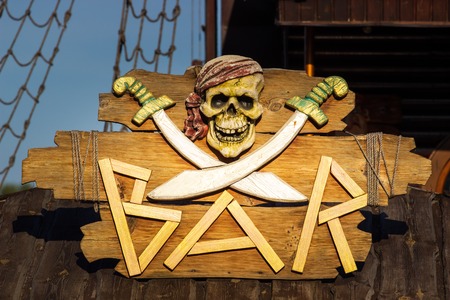 The signboard of the bar and Pirates beach on the shoreの写真素材