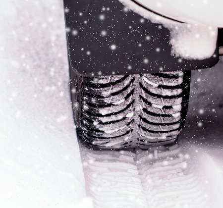 Car tires on winter road.の写真素材