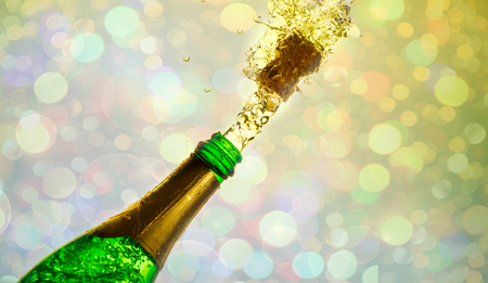 Close up of champagne cork popping on blokeh background.の写真素材
