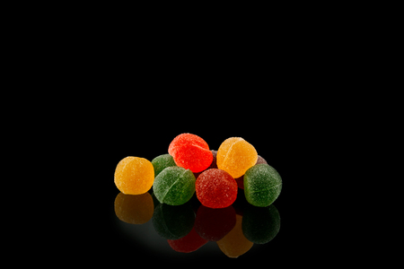 Multicolored, marmalade sweets on black background foodの写真素材