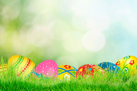 Row of Easter eggs in Fresh Green Grass