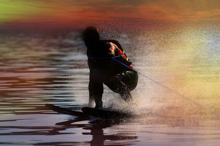 Waterskier silhouette with glowing spray