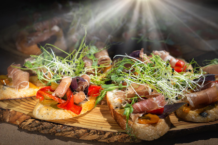 Smorrebrod, traditional Danish open sanwiches, rye bread with different topping, black background,の写真素材