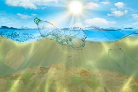 Creative background, plastic bag floating in the ocean, a bag in the water. The concept of environmental pollution, non-decomposable plastic, increased debris in the world's oceansの写真素材