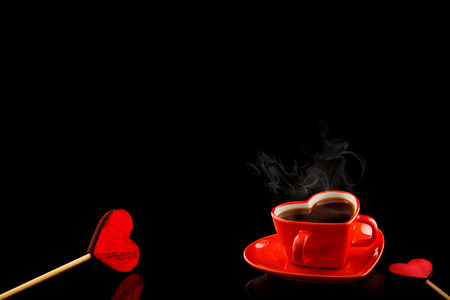Cups of coffee with heart on black backgroundの写真素材