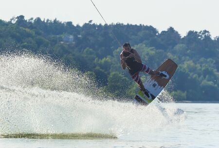 Cherkassy, Ukraine - July 19, 2019: Wakeboarder showing of tricks and skills at wakeboarding event in Cherkassyのeditorial素材