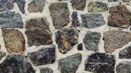 Background of stone wall texture. Old rock blocksの写真素材