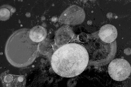 Texture of ice of Baikal lake in Siberia with air bubbles