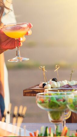 catering table set service with silverware and glass stemware at restaurant before party. Vertical photoの写真素材