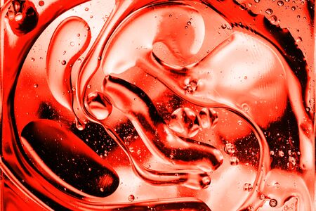 Abstract Lush Lava water drops soft light. Neon orange-red color background.の写真素材