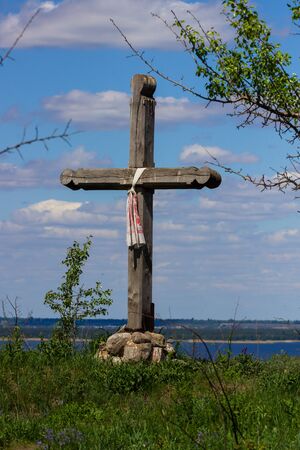 solitary cross on hill topの写真素材