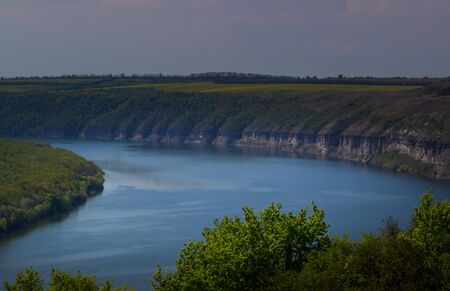 Zigzag river flows between summer valleys.Dniester river. Podolsk Tovtry Reserve