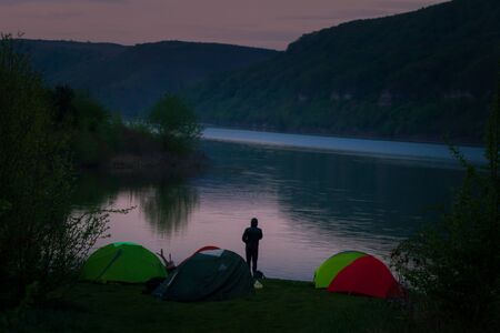 Mystical night landscape, in the foreground hike, campfire and tentの写真素材