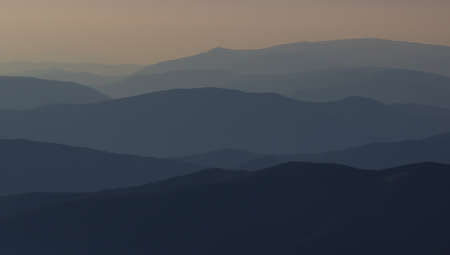 cross silhouette on the mountain at sunsetの写真素材