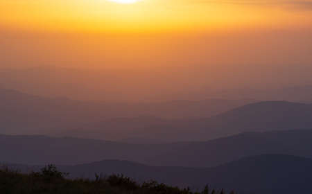 colorful sunset on top of austrian mountain alpsの写真素材