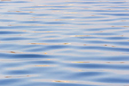 ripple surface water background. Light wavesの写真素材