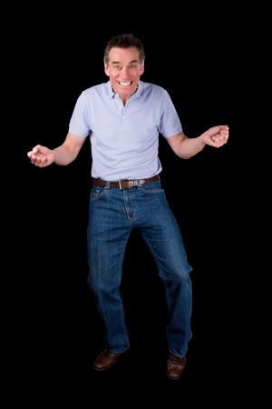 Funny Middle Age Man Dancing with Cheesy Grin Black Backgroundの写真素材