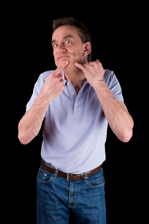 Funny Middle Age Man Squeezing Face Black Backgroundの写真素材