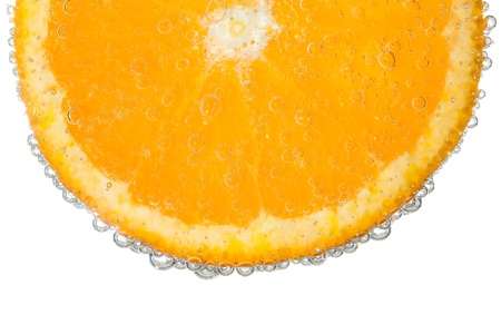 Orange Slice in Clear Fizzy Water Bubble Background Isolatedの写真素材