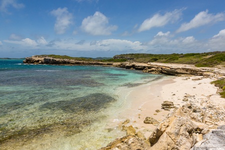 Beautiful Rustic Rocky Tropical Beach Near Devilの写真素材