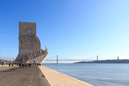 Padrao dos Descobrimentos - Monument to the Discoveries and 25 de Abril Bridge in Lisbonのeditorial素材