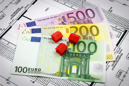 Architectural drawings of a house with euro banknotesの写真素材