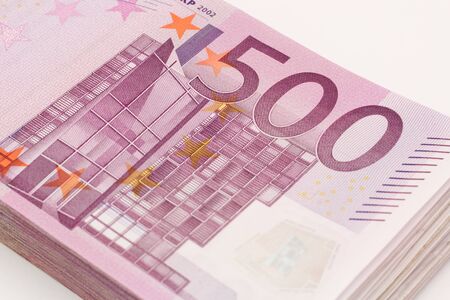 Money - Isolated stack of Five hundred 500 euro bills banknotes with white background