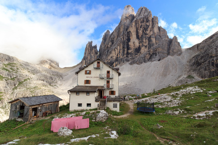 Alpine Hut Zsigmondyhutte and mountain Zwolferkofel in Sexten Dolomites, South Tyrol, Italyの写真素材