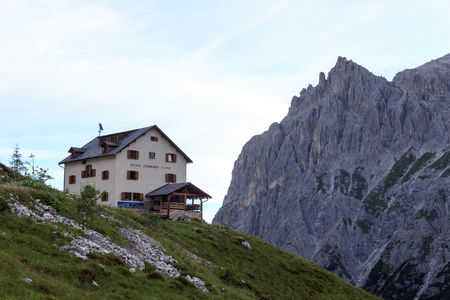 Mountain panorama and alpine Hut Zsigmondyhutte in Sexten Dolomites, South Tyrol, Italyのeditorial素材