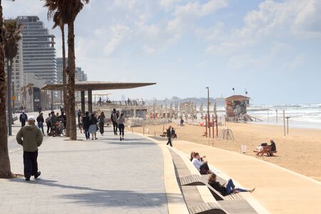 Promenade in city Tel Aviv with beach, urban skyscrapers and mediterranean sea, Israelの写真素材