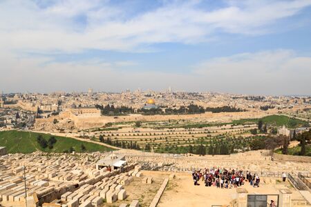 Mount of Olives Jewish Cemetery and Jerusalem Old city cityscape panorama with Dome of the Rock with gold leaf and Al-Aqsa Mosque on Temple Mount and Rotunda of Church of the Holy Sepulchre, Israelの写真素材