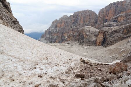 Alpine hut Rifugio Alimonta and mountain alps panorama in Brenta Dolomites, Italyの写真素材