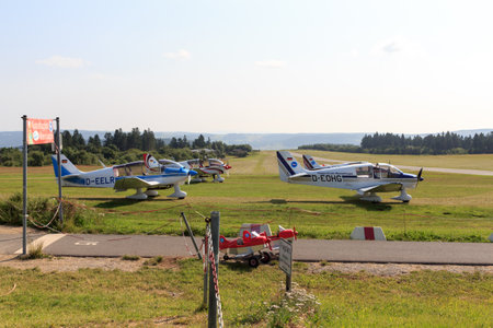 Gersfeld, Germany - July 23, 2021: Powered aircrafts (propeller planes) on Wasserkuppe airfield in Rhoen Mountains. The airfield is the most elevated in Germany.のeditorial素材