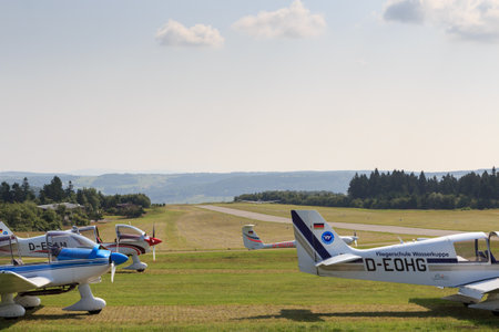 Gersfeld, Germany - July 23, 2021: Glider (sailplane) during takeoff on Wasserkuppe airfield in...