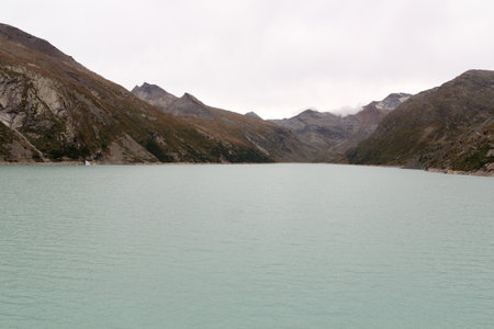 Reservoir Mattmark dam lake and mountain panorama view near Saas-Fee, Pennine Alps, Switzerlandの写真素材