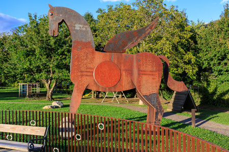 Burglehen Park with steel horse, benches and playground in Tirolo (Dorf Tirol), South Tyrol, Italyの写真素材